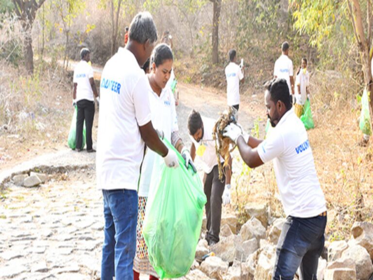 Volunteer team conducting awareness drive in rural village